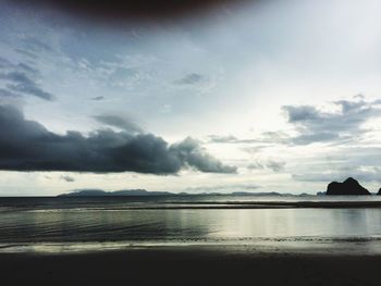 Scenic view of sea against cloudy sky