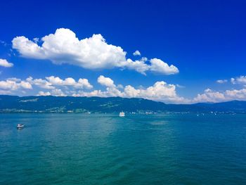 Scenic view of sea against blue sky