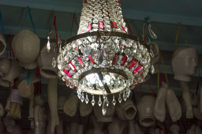 Low angle view of illuminated lanterns hanging on ceiling