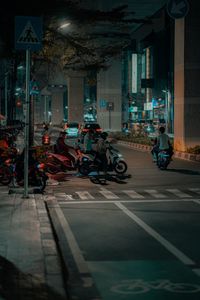 Cars on street against buildings in city