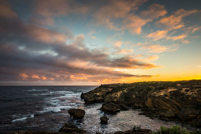 Scenic view of sea at sunset