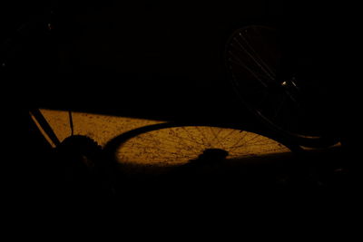High angle view of silhouette bicycle at night