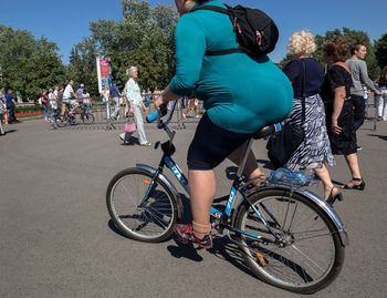 Man riding bicycle on road