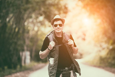 Man wearing sunglasses standing outdoors