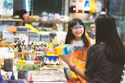 Portrait of a smiling young woman standing outdoors