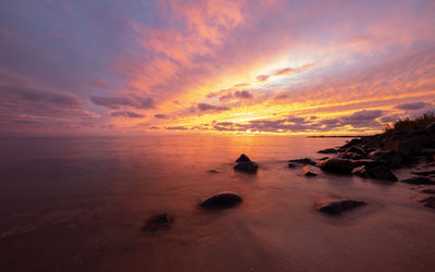 Scenic view of sea against sky during sunset