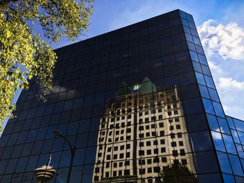 Low angle view of modern building against sky
