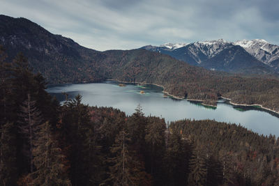 Scenic view of lake and mountains against sky