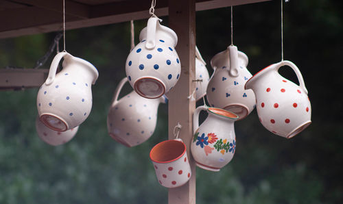 Close-up of crockery hanging for sale