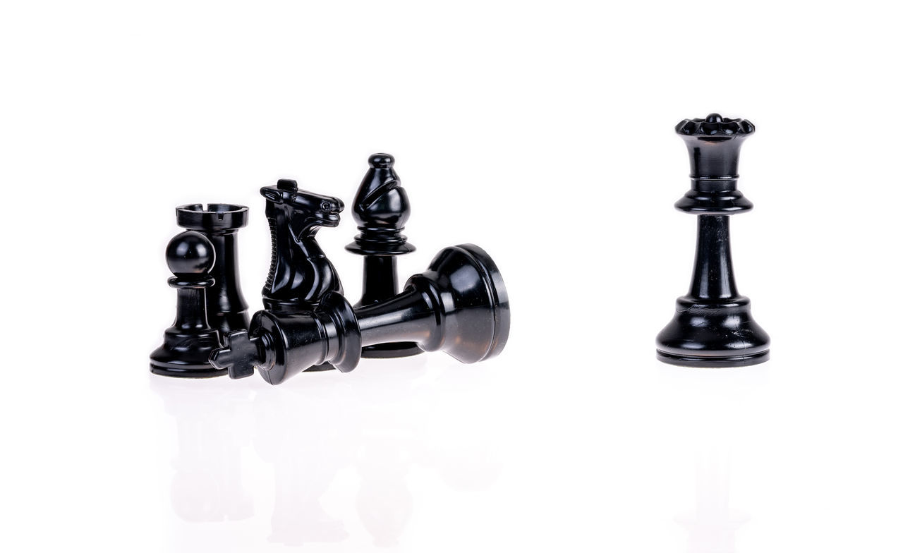 DIGITAL COMPOSITE IMAGE OF CHESS PIECES ON WHITE BACKGROUND