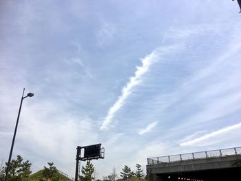 Low angle view of vapor trail against sky