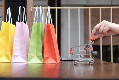 Close-up of hand holding paper at store