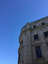 Low angle view of building against blue sky