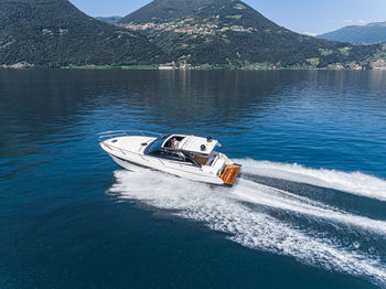 High angle view of boat sailing in lake