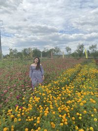 Full length of woman standing on field