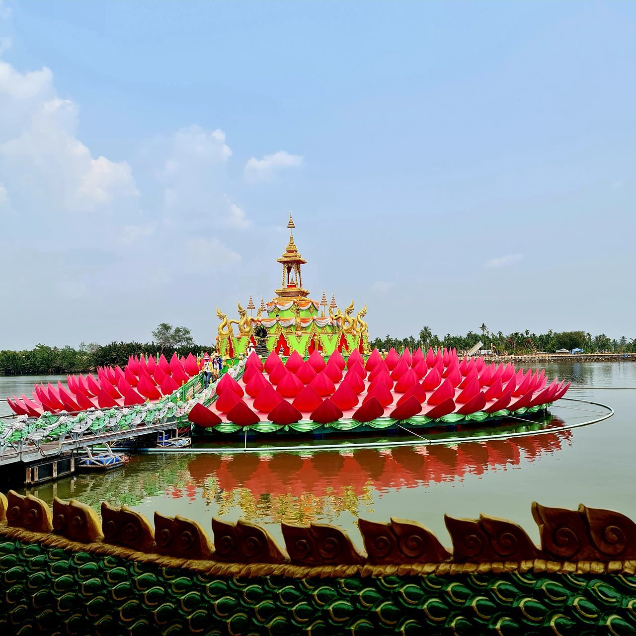 RED FLOWERS IN TEMPLE BUILDING