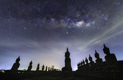 Low angle view of statue against sky