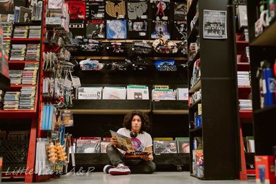 Portrait of woman sitting at store