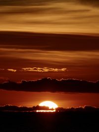 Scenic view of dramatic sky during sunset
