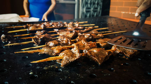 Close-up of meat on barbecue grill