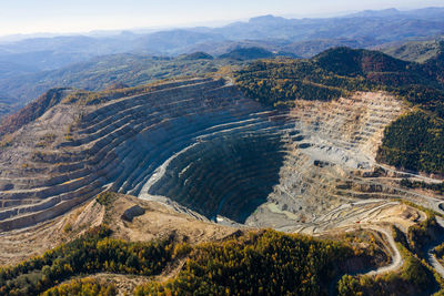 Aerial drone view of rosia poieni open pit copper mine, romania