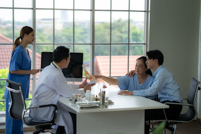 Female doctor working at office