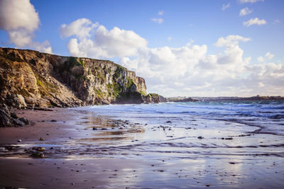 Scenic view of beach and sea against sky