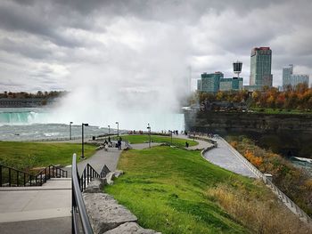 Scenic view of river against cloudy sky