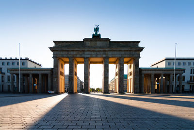 Gate against clear blue sky during sunset