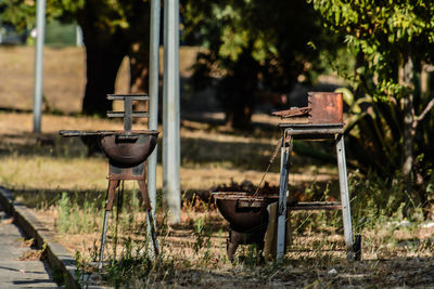 Empty chair on barbecue grill