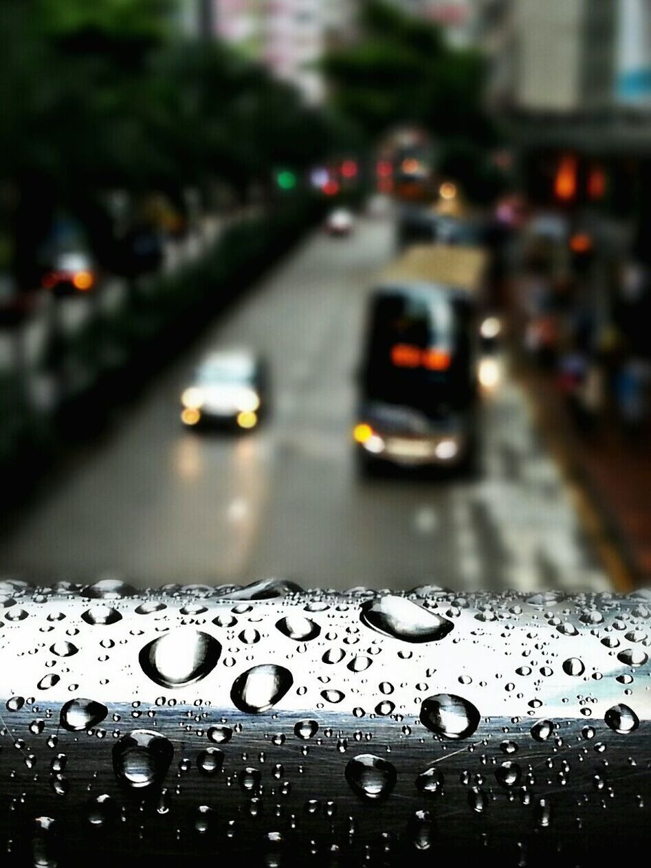 transportation, wet, car, drop, land vehicle, mode of transport, rain, water, raindrop, street, transparent, glass - material, windshield, focus on foreground, road, window, weather, selective focus, on the move, season