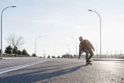 Young man skateboarding in the street