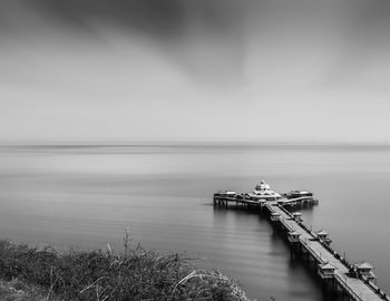 Narrow jetty leading to calm sea