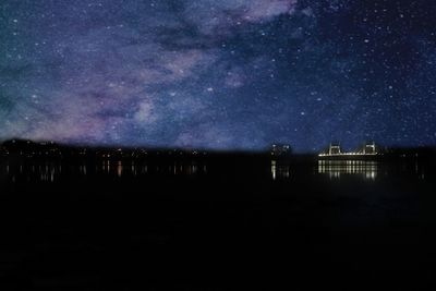 Scenic view of illuminated building against sky at night