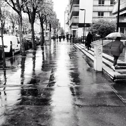 People walking on street in city