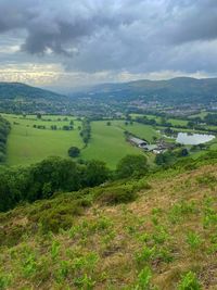 Scenic view of agricultural landscape against sky