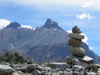 Rocks on mountain against sky