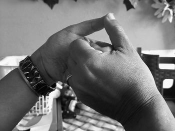 Close-up of man holding hands