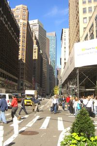 People on city street amidst buildings