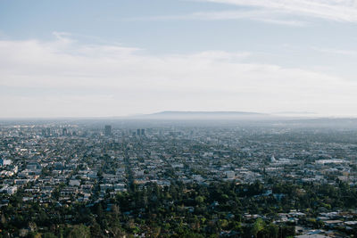 Aerial view of cityscape against sky