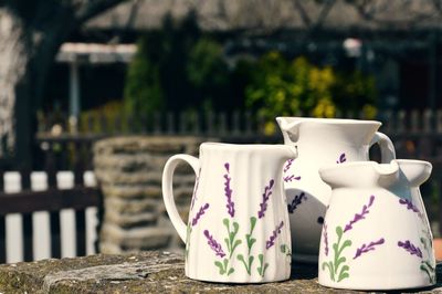 White jugs on wall