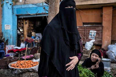 Woman standing at market stall