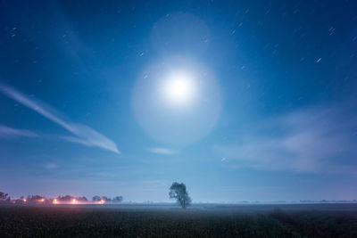 Scenic view of field against sky at night