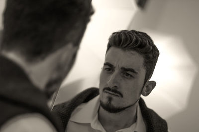 Close-up of young man at home