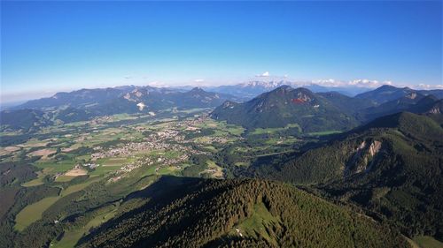 Scenic view of mountains against clear blue sky