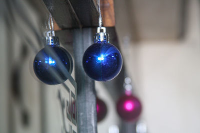 Close-up of multi colored lights hanging on metal