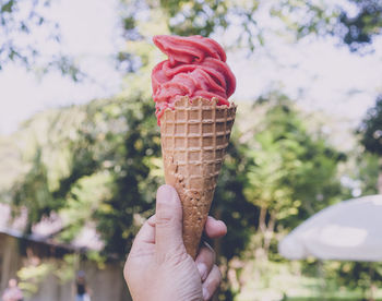 Hand holding ice cream cone