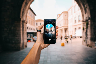 Close-up of hand holding smart phone