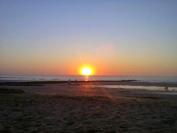 Scenic view of sea at sunset