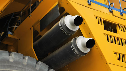 Close-up of two exhaust pipes of a dump truck. exhaust system of the world's largest dump truck